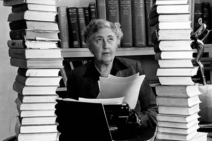 Agatha Christie, surrounded by some of her 80-plus crime novels.